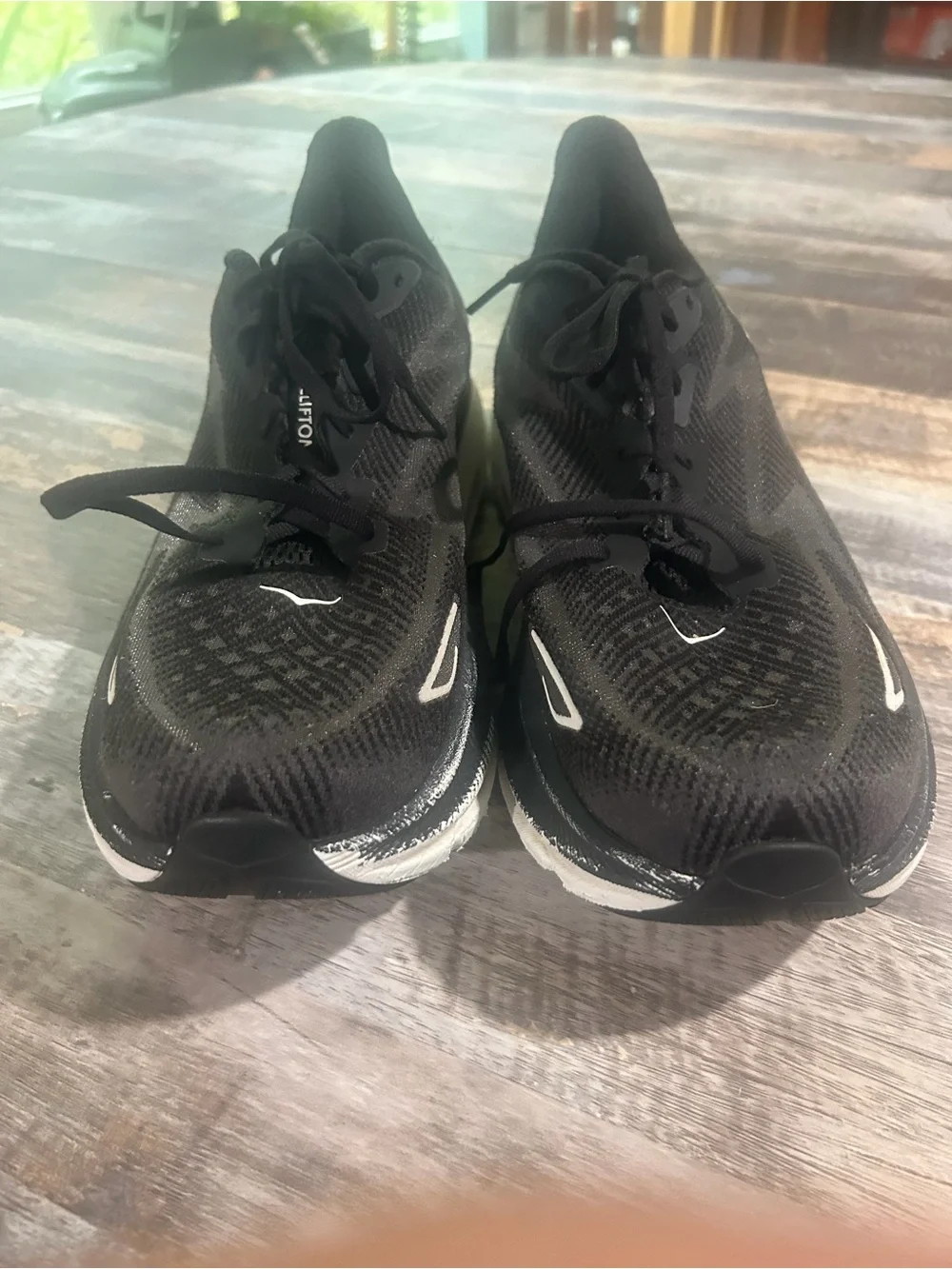 Men's size 11.5D Hoka Black and White Road Running Shoes